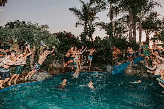 Friends enjoying a summer pool party together