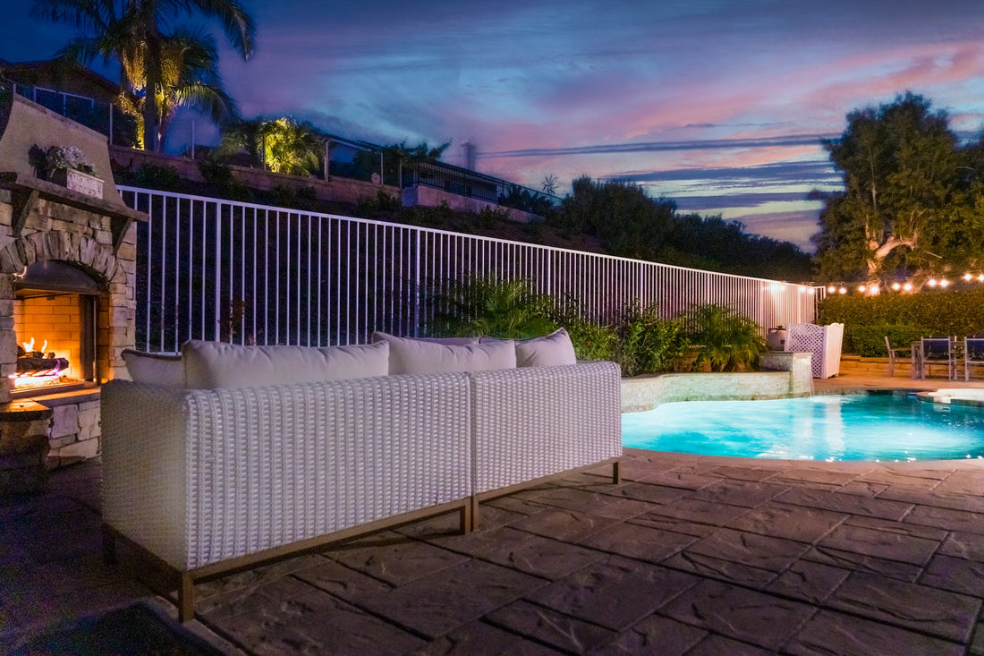 Luxury backyard pool patio at sunset